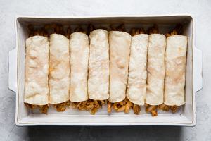 simple chicken mole enchiladas in a baking dish