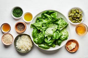 butter lettuce, apple cider vinegar, honey, olive oil, olives, panko, chives, manchego cheese and ground pepper in prep bowls