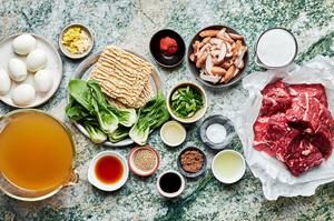 all the ingredients for slow cooker curry beef ramen prepped and in prep bowls on the counter