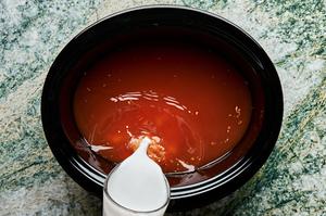 broth mixture made with coconut milk, red curry paste, lime juice, ginger, garlic, soy sauce, fish sauce, and brown sugar