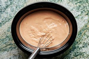 broth mixture made with coconut milk, red curry paste, lime juice, ginger, garlic, soy sauce, fish sauce, and brown sugar