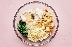shallots, spinach, artichoke hearts, mayo, cream cheese, lemon juice, garlic powder, pepper, mozzarella & parmesan in a bowl