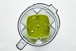 herb vinaigrette in a blender made with olive oil, balsamic, lemon juice, garlic, mustard, basil, mint, honey, salt & pepper