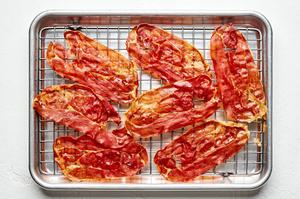 crispy pancetta on a cooling rack