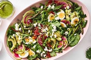 spring cobb salad with boiled egg, pancetta, asparagus, avocado, goat cheese, snap pea, sunflower seed & herb vinaigrette