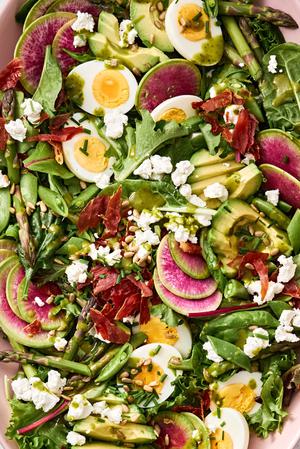 spring cobb salad with boiled egg, pancetta, asparagus, avocado, goat cheese, snap pea, sunflower seed & herb vinaigrette