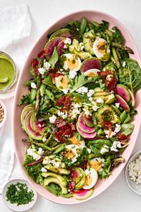 spring cobb salad with boiled egg, pancetta, asparagus, avocado, goat cheese, snap pea, sunflower seed & herb vinaigrette