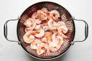 steamed shrimp draining in a colander