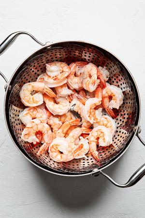 steamed shrimp draining in a colander