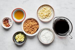 tamari, sesame oil, garlic, ginger, brown sugar, red pepper flakes and cornstarch in prep bowls to make stir fry sauce