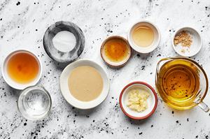 tahini, olive oil, apple cider vinegar, salt, sesame oil, honey, ginger powder, garlic & water in prep bowls