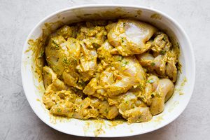 tandoori chicken marinating in a bowl