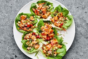 a plate of teriyaki lettuce cups made with broccoli, bell pepper, cashews, water chestnuts and homemade teriyaki sauce