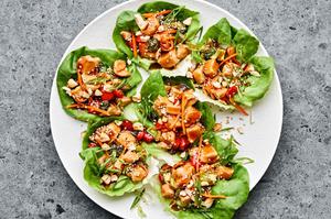 a plate of teriyaki lettuce cups made with broccoli, bell pepper, cashews, water chestnuts and homemade teriyaki sauce