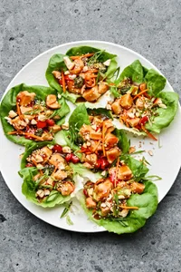 a plate of teriyaki lettuce cups made with broccoli, bell pepper, cashews, water chestnuts and homemade teriyaki sauce