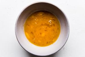 beaten eggs in a bowl with sesame oil