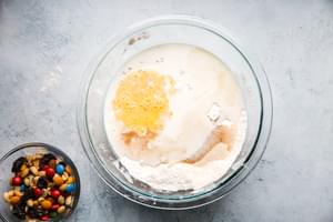 butter milk and flour mixed in a bowl for pancakes