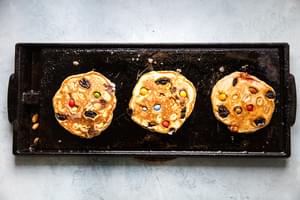 trail mix pancakes on a griddle