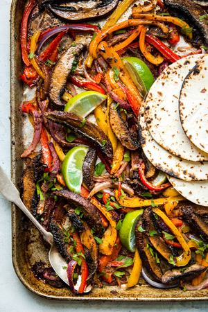 vegan Portobello Mushroom Fajitas on a sheet pan with tortillas