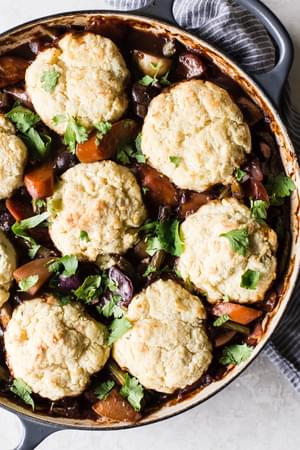 Vegetable Pot Pie with biscuits on top in a braiser