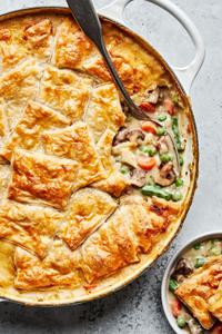 homemade vegetable pot pie being scooped into a bowl