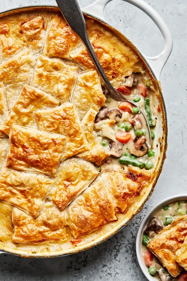 homemade vegetable pot pie being scooped into a bowl