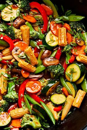 vegetable stir fry made with mushrooms, broccoli, corn, pepper, snap peas, zucchini & carrots with homemade sauce