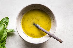 poppyseed dressing in a bowl with a spoon
