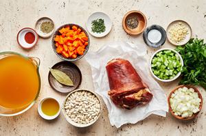cannelini beans, ham, olive oil, onion, carrots, celery, garlic & spices in prep bowls to make white bean and ham soup