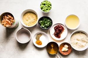 ingredients laid out for vegan cashew chipotle cream sauce garbanzo beans, edamame, almond flour, garlic, lemon juice