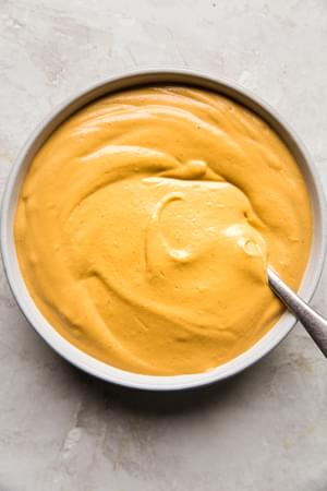 vegan cashew chipotle cream sauce in a bowl yumm sauce with a spoon