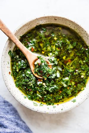 chimichurri sauce made with shallot, parsley, garlic, oregano, salt, pepper, olive oil, red wine vinegar & red pepper flakes