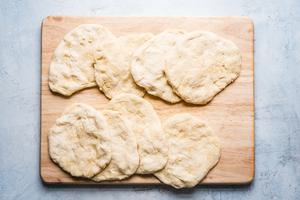 8 raw flat bread dough ready for the grill