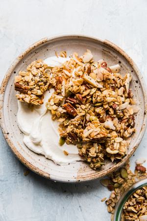 homemade granola over yogurt in a bowl