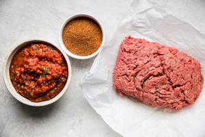 ground beef, taco seasoning and salsa for taco meat in the slow cooker