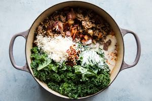 zuppa toscana soup with kale, parmesan bacon and sausage being cooked in a soup pot